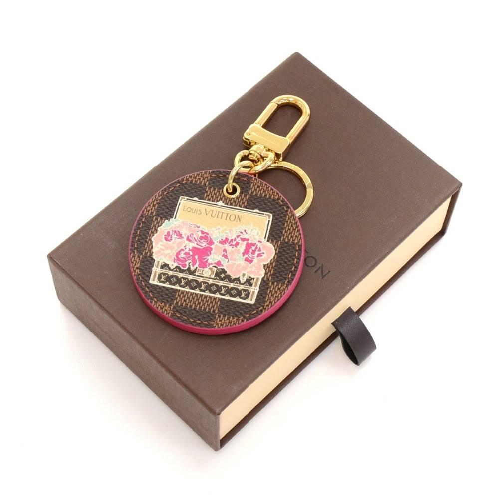 Louis Vuitton Illustre Pink Posies Damier Key holder/Bag charm. Rare design would make your keys easy to find. Would as well look great hanging on your bag.

Made in: Spain
Size: 4.3 x 2.6 x 0 inches or 11 x 6.5 x 0 cm
Color: Pink
Dust bag:   Not