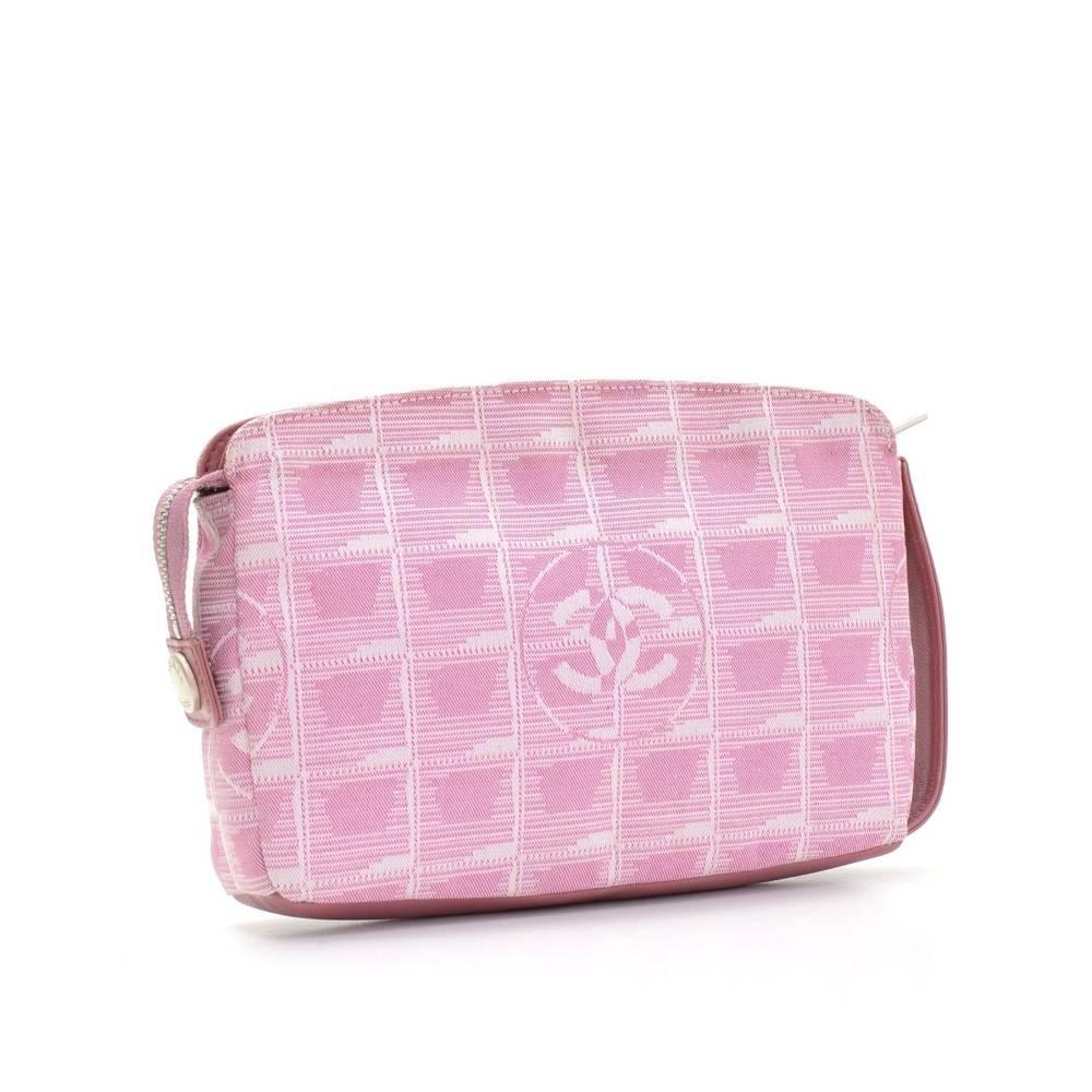 Chanel Travel Line bag in pink Jacquard nylon. Top has zipper closure. Inside has beige washable lining. This stunning bag lightweight and easy access. 

Made in: France
Serial Number: 6444838
Size: 7.9 x 5.5 x 1.2 inches or 20 x 14 x 3 cm
Color: