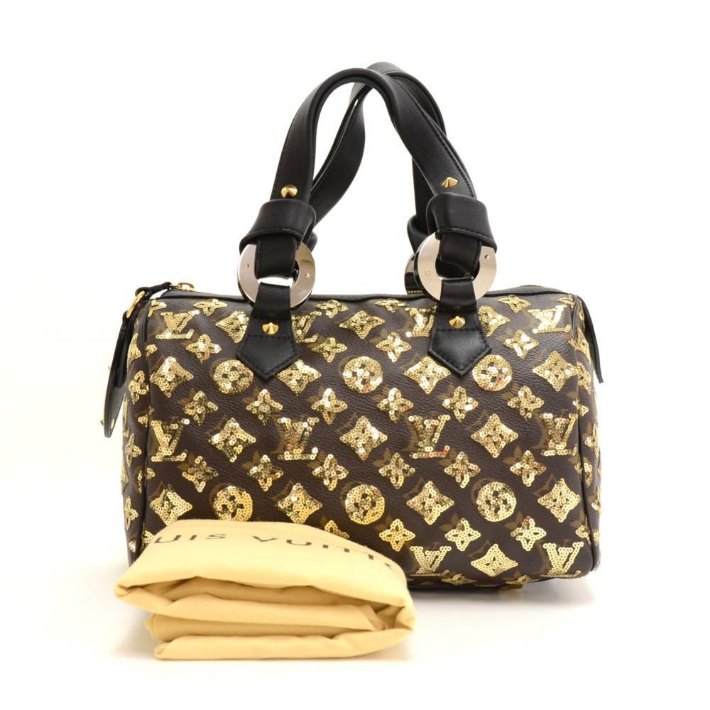 Louis Vuitton Speedy 25 hand bag in Monogram Eclipse Canvas. It offers light weight elegance in a compact format. Inspired by the famous keep all travel bag, it features a zip closure. This luxury bag limited from 2009-2010 would make great