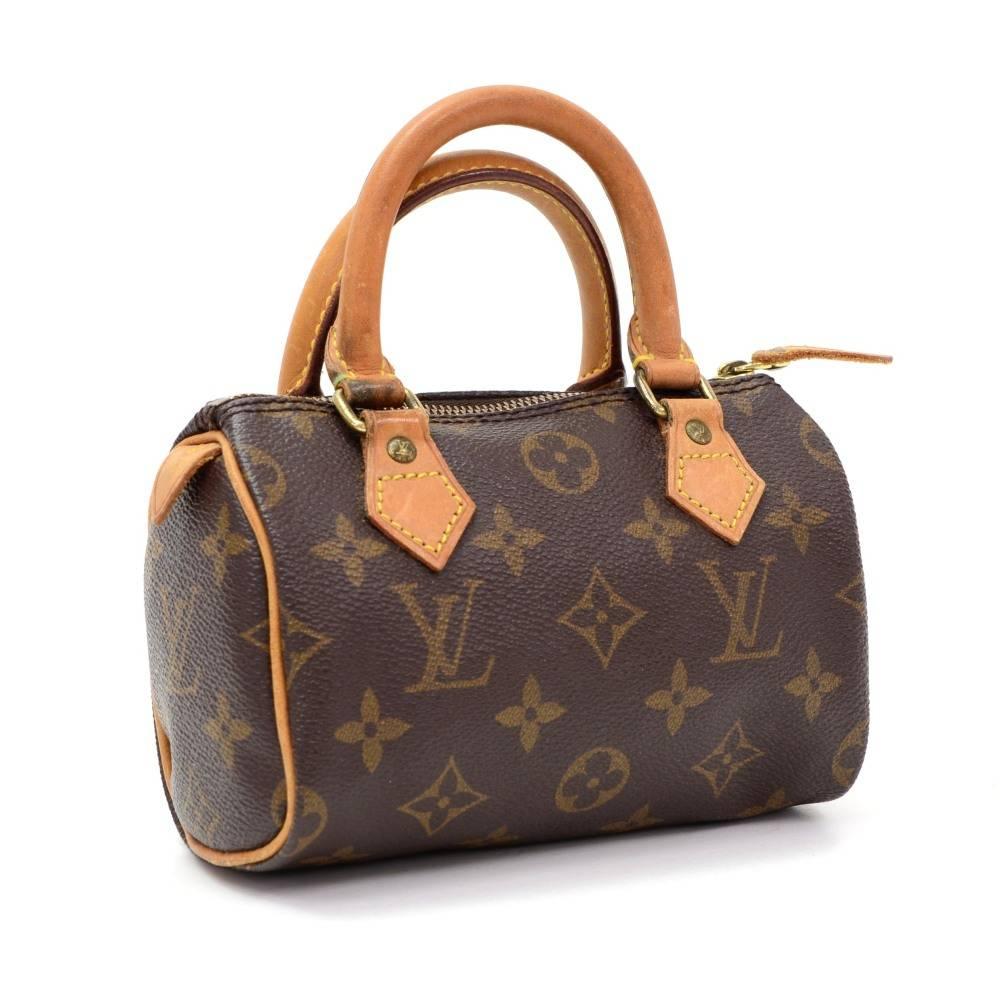 Louis Vuitton handbag Mini Speedy Sac HL, one of the most popular line in LV monogram canvas. Brass zipper securing access. Inside is brown lining. Very cute item to have. 

Made in: France
Serial Number: T H 0 9 1 5
Size: 5.9 x 3.9 x 2.8 inches or