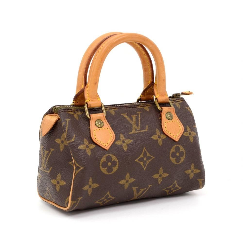 Louis Vuitton handbag Mini Speedy Sac HL, one of the most popular line in LV monogram canvas. Brass zipper securing access. Inside is brown lining. Very cute item to have. 

Made in: France
Size: 5.9 x 3.9 x 2.8 inches or 15 x 10 x 7 cm
Color: