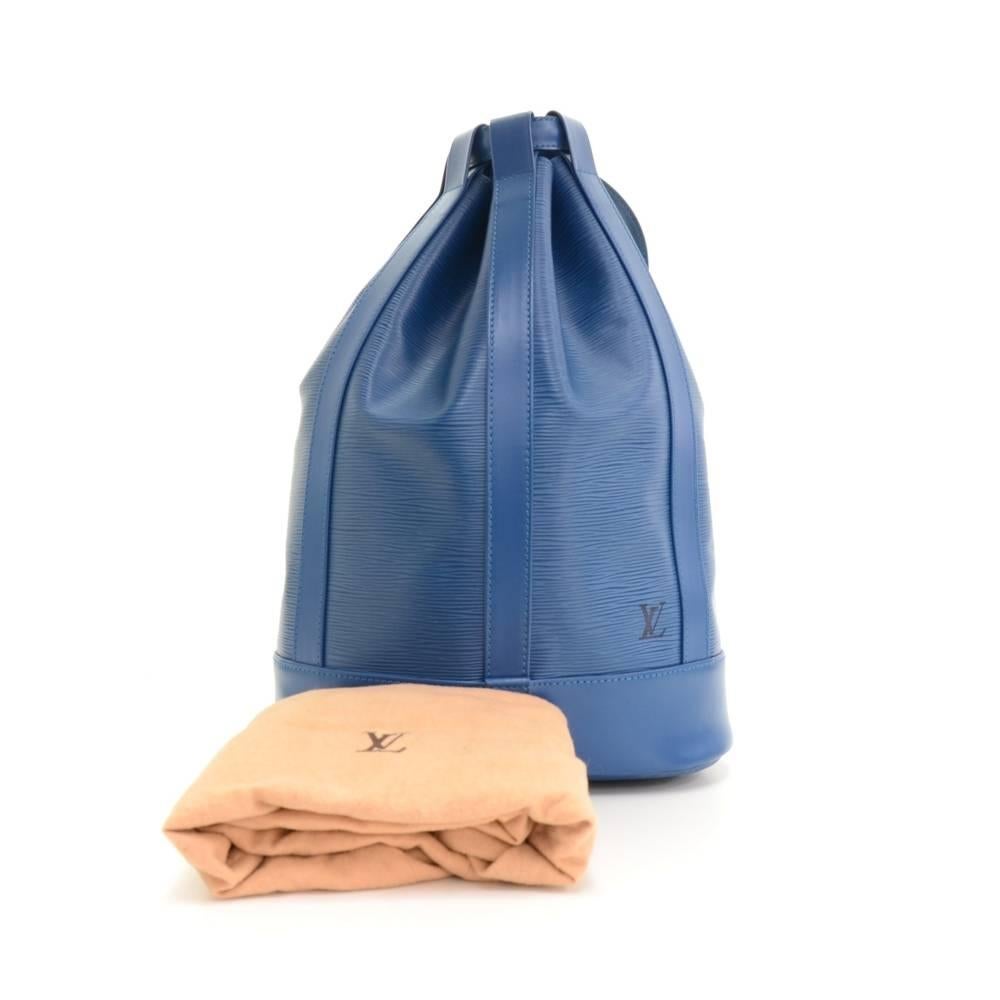 Louis Vuitton large Randonnee shoulder bag Toledo Blue Epi leather . It has straps which can be used on shoulder. Inside it has a D ring inside to attach small pouches or other items. This is a discontinued item! 

Made in: France
Serial Number: