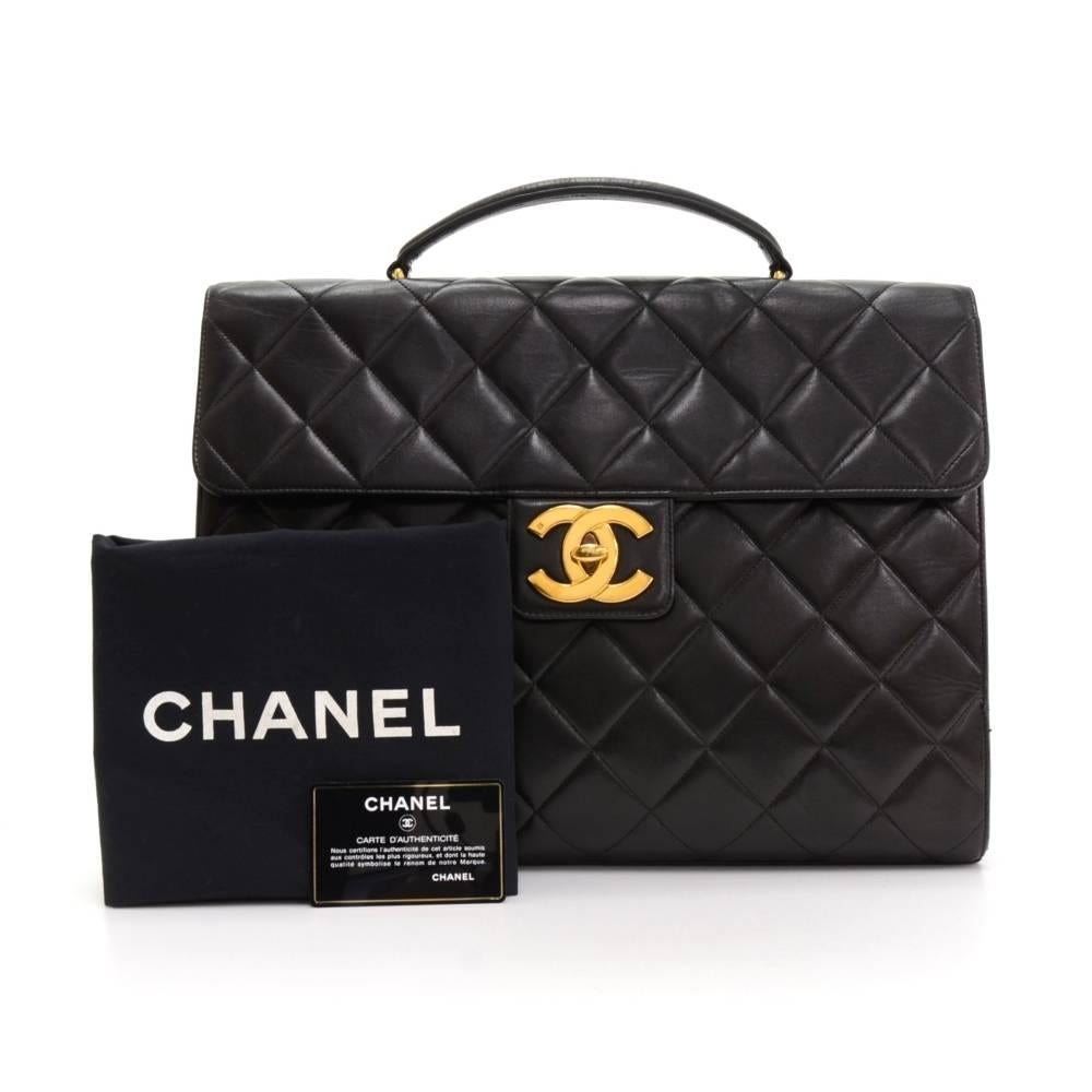 Chanel Handbag / briefcase in black quilted leather. On the back is large slip in pocket. Flap top is secured with large CC hardware twist lock. Inside is leather lining with 2 pockets: 1 open and 1 with zipper. Wonderful classic design would make a