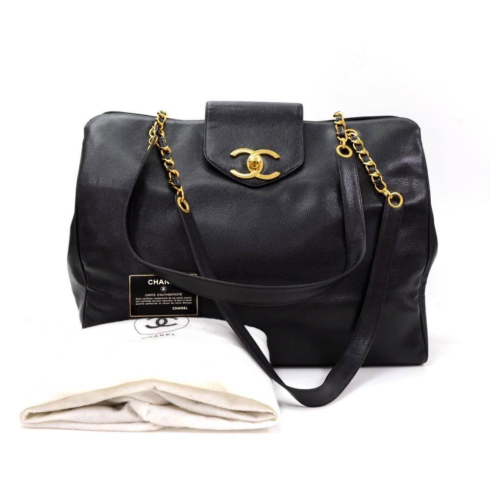 Chanel XL Supermodel Tote in black caviar Leather. Top is secured with small flap with large CC twist lock. It has splited into 3 compartments: middle is secured with zippers and has 2 interior pockets. 2 other compartments are open and offer easy