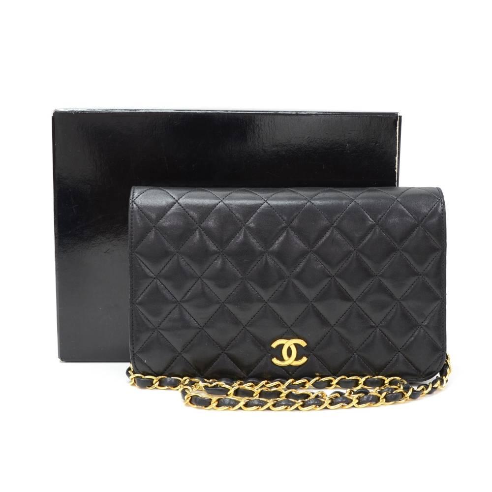 Chanel Black leather quilted shoulder bag. It has a flap with famous CC stud closure on the front. Inside has Chanel red leather lining with 1 zipper pocket. It can be carried on shoulder, as clutch or across body.

Made in: France
Serial Number: