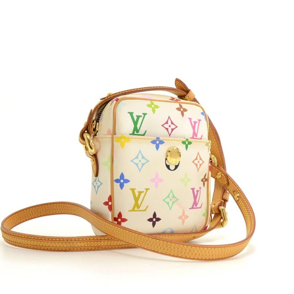 Louis Vuitton Rift shoulder bag in white multicolor monogram canvas. It has pocket with large stud closure on front. Top is closed by zipper. Inside is alkantra lining and 1 open pocket. Can carried on shoulder or across body with adjustable cowhide