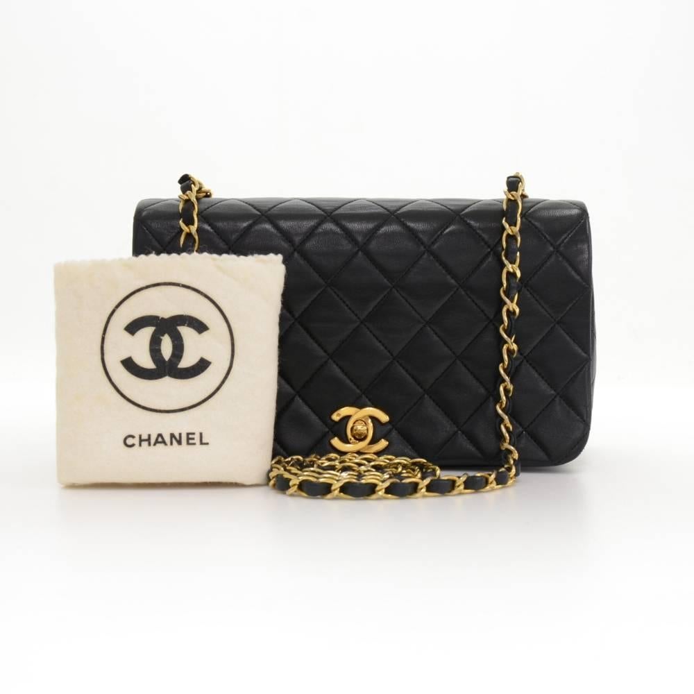 Chanel Black leather quilted shoulder bag. It has a flap with famous CC twist closure on the front. Inside has Chanel red leather lining with 1 zipper pocket and 1 open pocket splitted into 3 compartments. It can be carried on shoulder or across