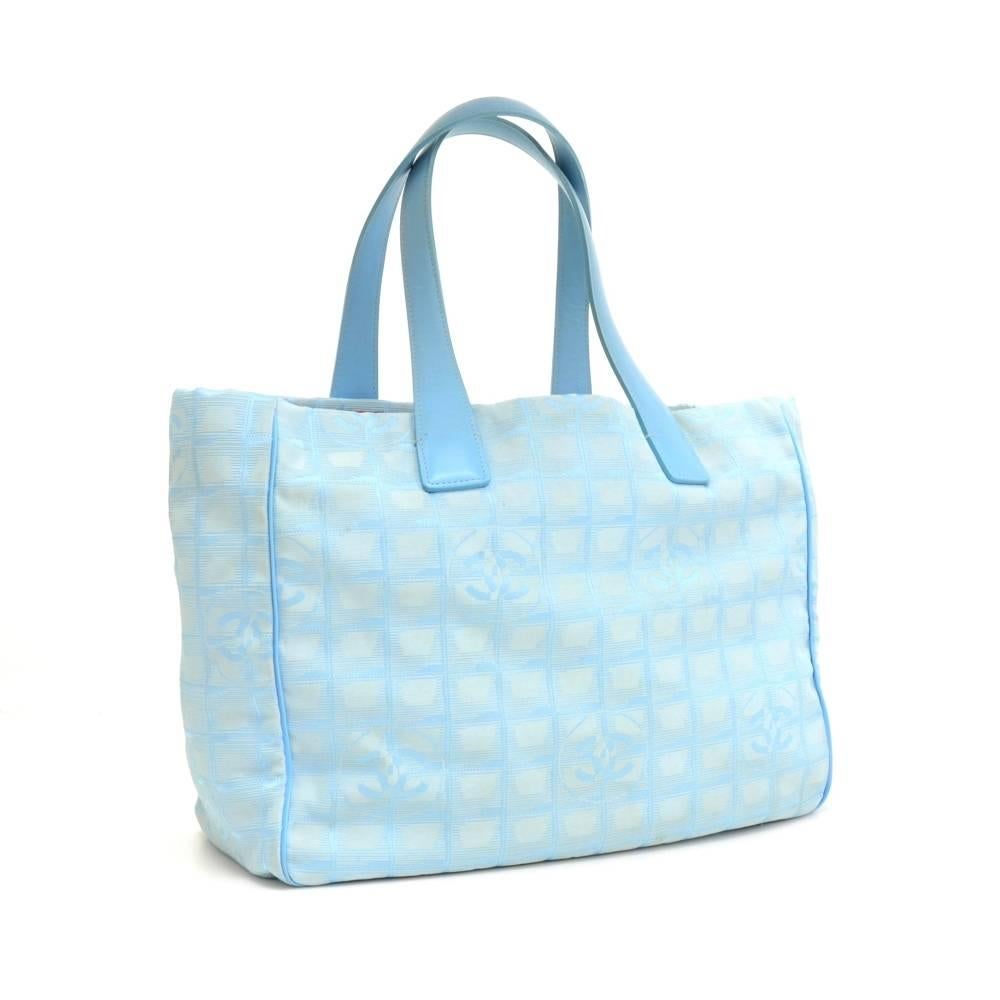 Chanel Travel Line Tote Bag in Jacquard nylon. Inside has blue washable lining with 2 zipper pockets. This stunning bag offers great capacity and easy access.

Made in: France
Serial Number: 7470395
Size: 13 x 6.3 x 5.5 inches or 33 x 16 x 14