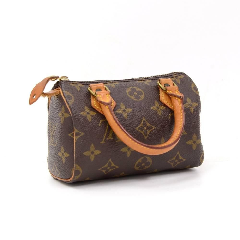 Louis Vuitton handbag Mini Speedy Sac HL, one of the most popular line in LV monogram canvas. Brass zipper securing access. Inside is brown lining. Very cute item to have. 

Made in: France
Serial Number: T H 0 9 4 2
Size: 5.9 x 3.9 x 2.8 inches or