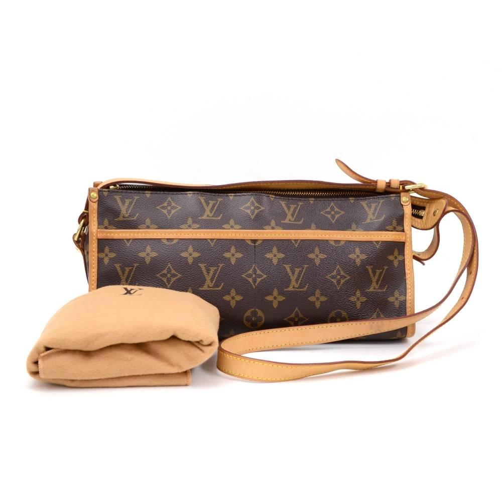 Louis Vuitton Popincourt Long Monogram Canvas Shoulder Bag. It has 2 open pockets on each side. Top is secured with double zipper. Inside is in brown canvas lining with open space. Carried on shoulder or across body with adjustable strap. 

Made in: