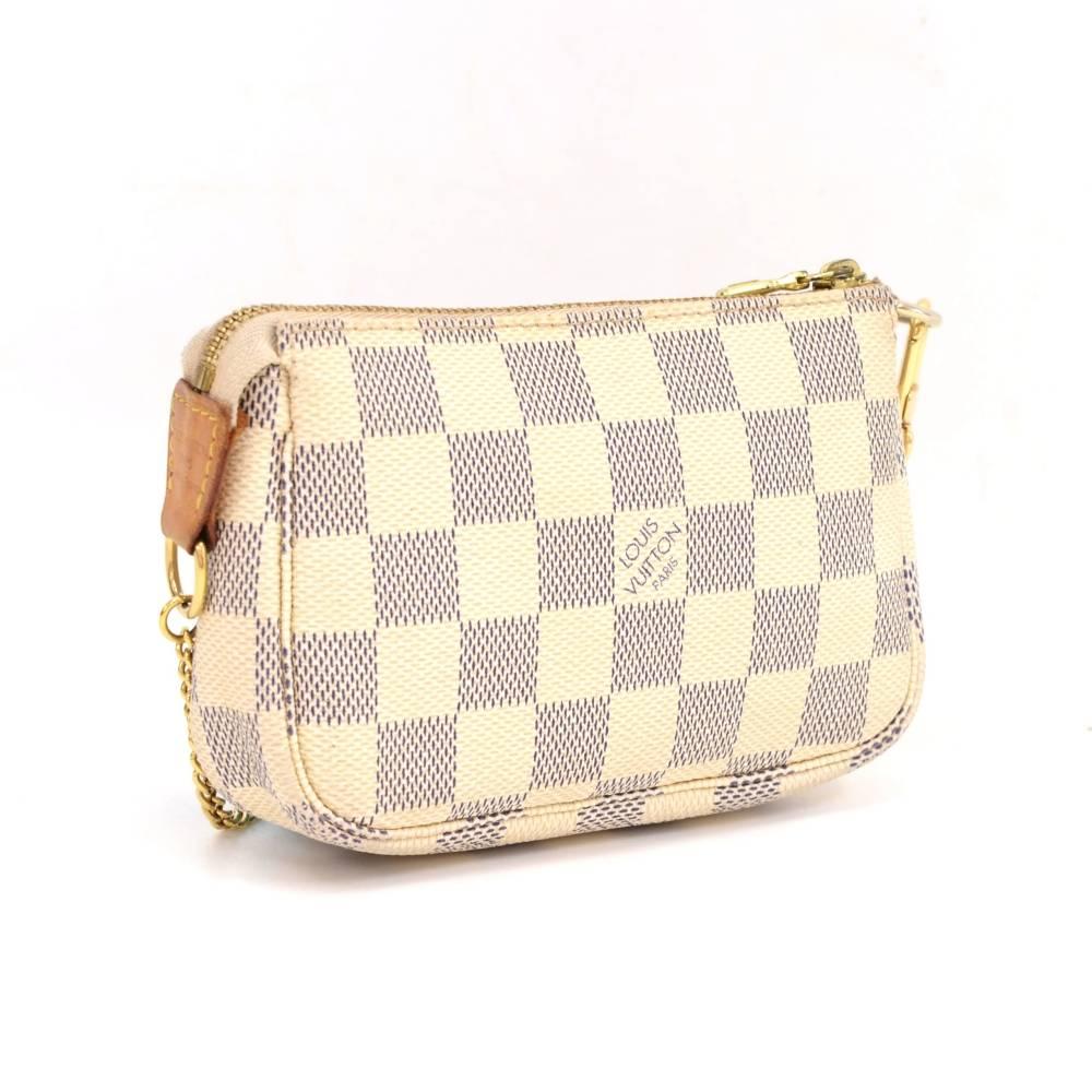 Louis Vuitton mini pochette accessories in azur damier canvas. Perfect for a night out and parties. It can be either hand-held or linked to the D-ring found in many Louis Vuitton.

Made in: France
Serial Number: F L 0 0 1 7
Size: 5.5 x 3.7 x 1.2