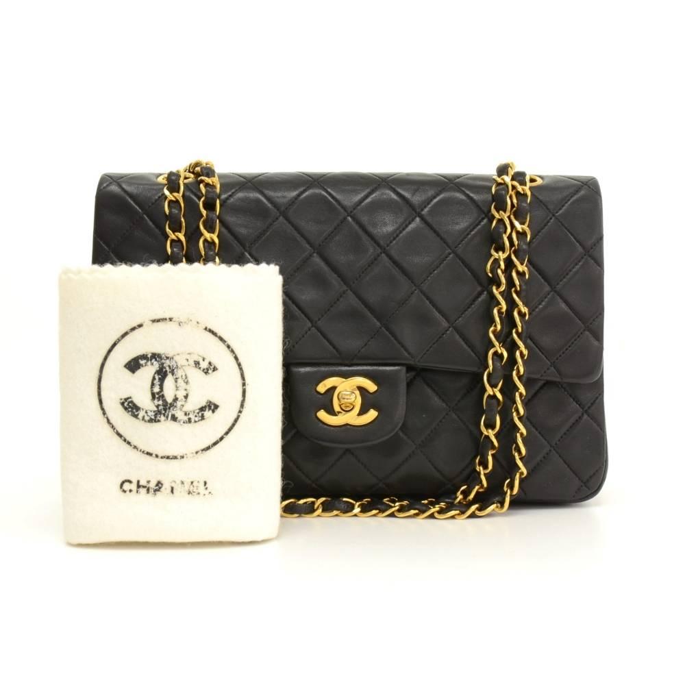 Chanel black quilted leather bag with double flap. It has CC twist lock on the front flap. Second flap has stud closure. Underneath it, there is one slip in pocket and inside lining is in famous Chanel red leather. One interior open pocket is split