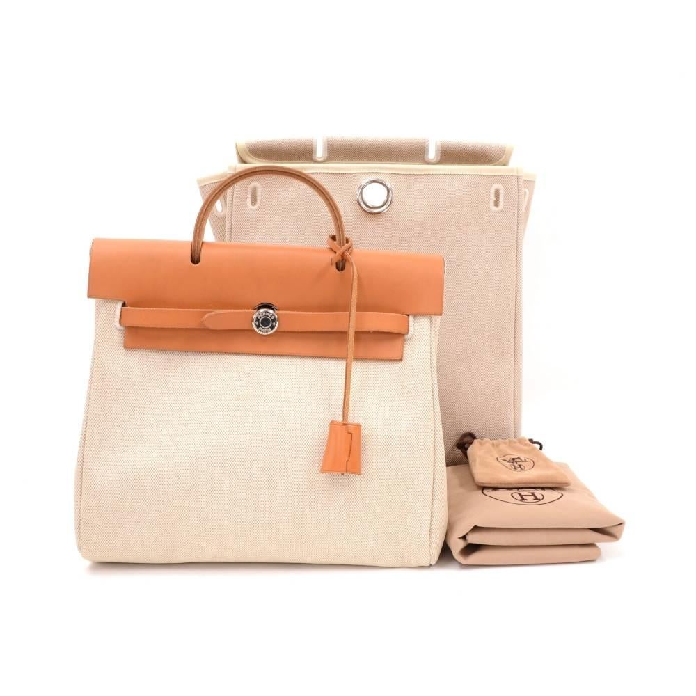 Hermes Herbag canvas x leather hand/backpack bag. Top leather pierce, handle and strap can be attached to both canvas bags for different size. Very stylish bag. Small canvas bag: App 11.8 x 10.6 x 3.9 inches or 28 x 27 x 11 cmLarge canvas Bag: App