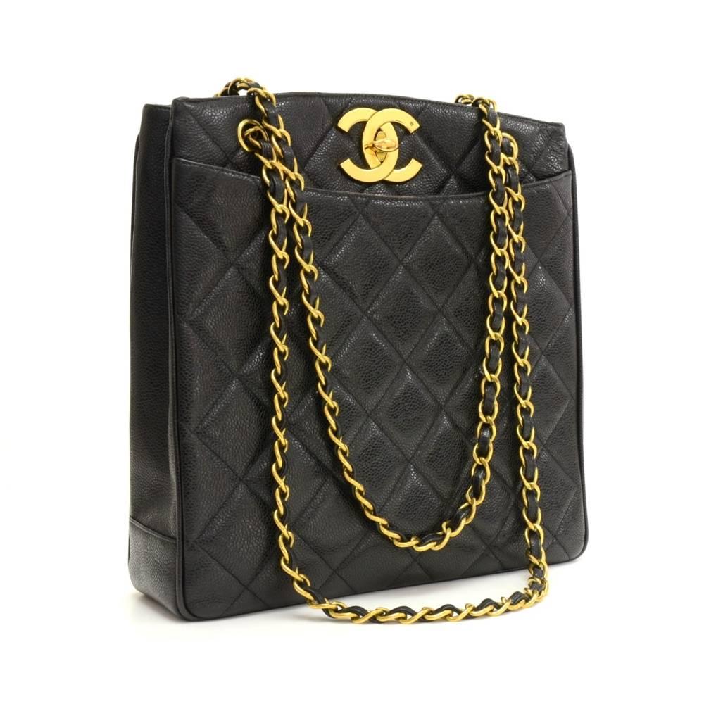 Chanel tote in black quilted caviar leather. It has 1 open slip pocket on each side. Main access secured with large CC logo twist lock. Inside has leather lining and 2 zipper pockets. Comfortably carried on shoulder and offers great capacity.

Made