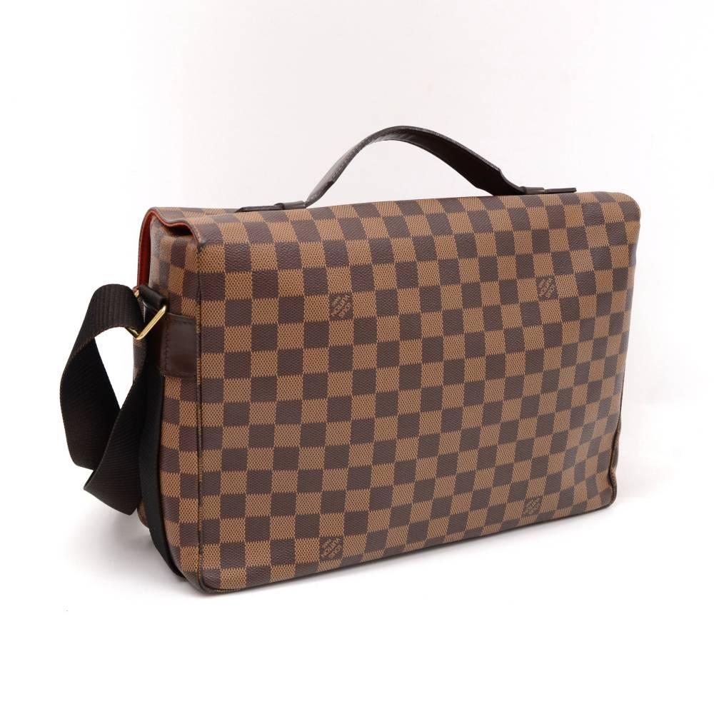 Louis Vuitton Broadway messenger/shoulder bag in brown Damier Canvas. It has flap with two belt closure and double zipper. Inside is in red canvas lining with 2 open exterior and interior pockets. Can be used as shoulder or messenger bag and offer