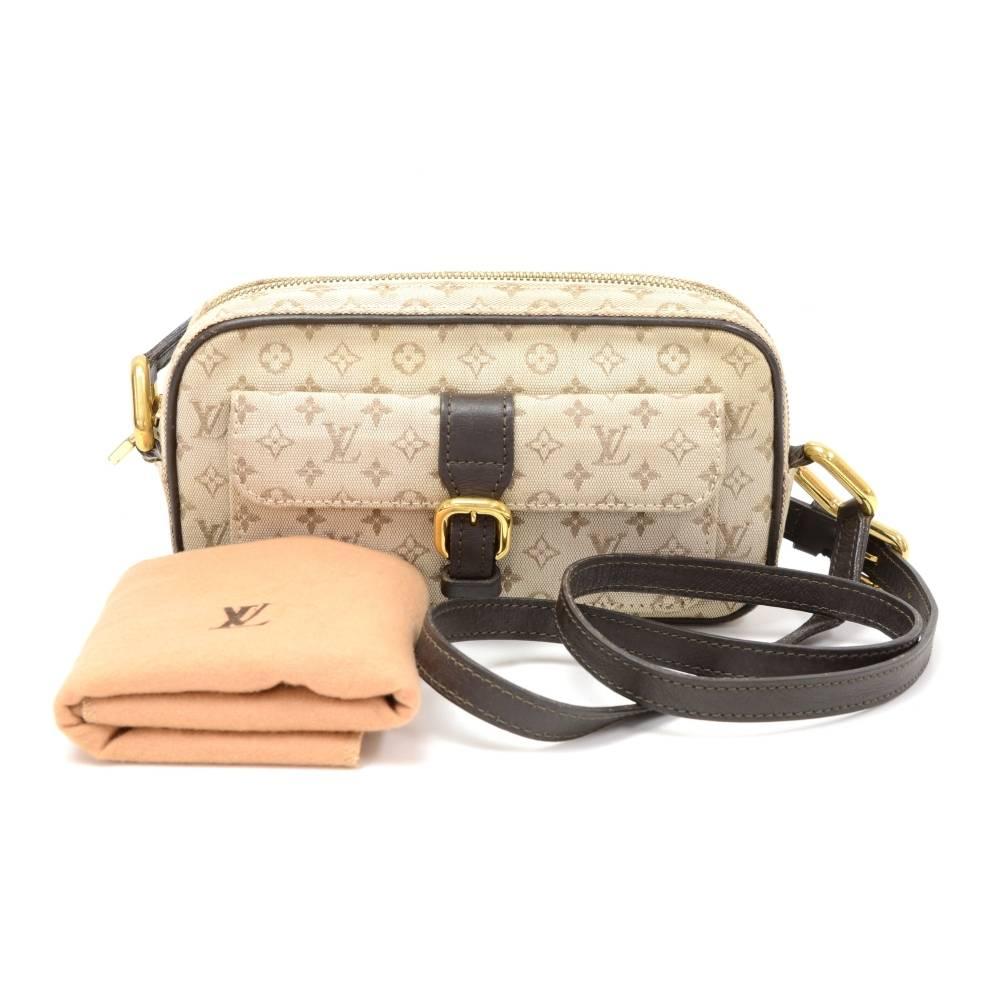 Louis Vuitton Juliet PM shoulder bag in Mini Monogram Canvas. It has small pocket with flap and belt closure in front. Top secured with zipper. Inside has one open pocket. Carried on shoulder or across body with adjustable strap. Perfect for daily