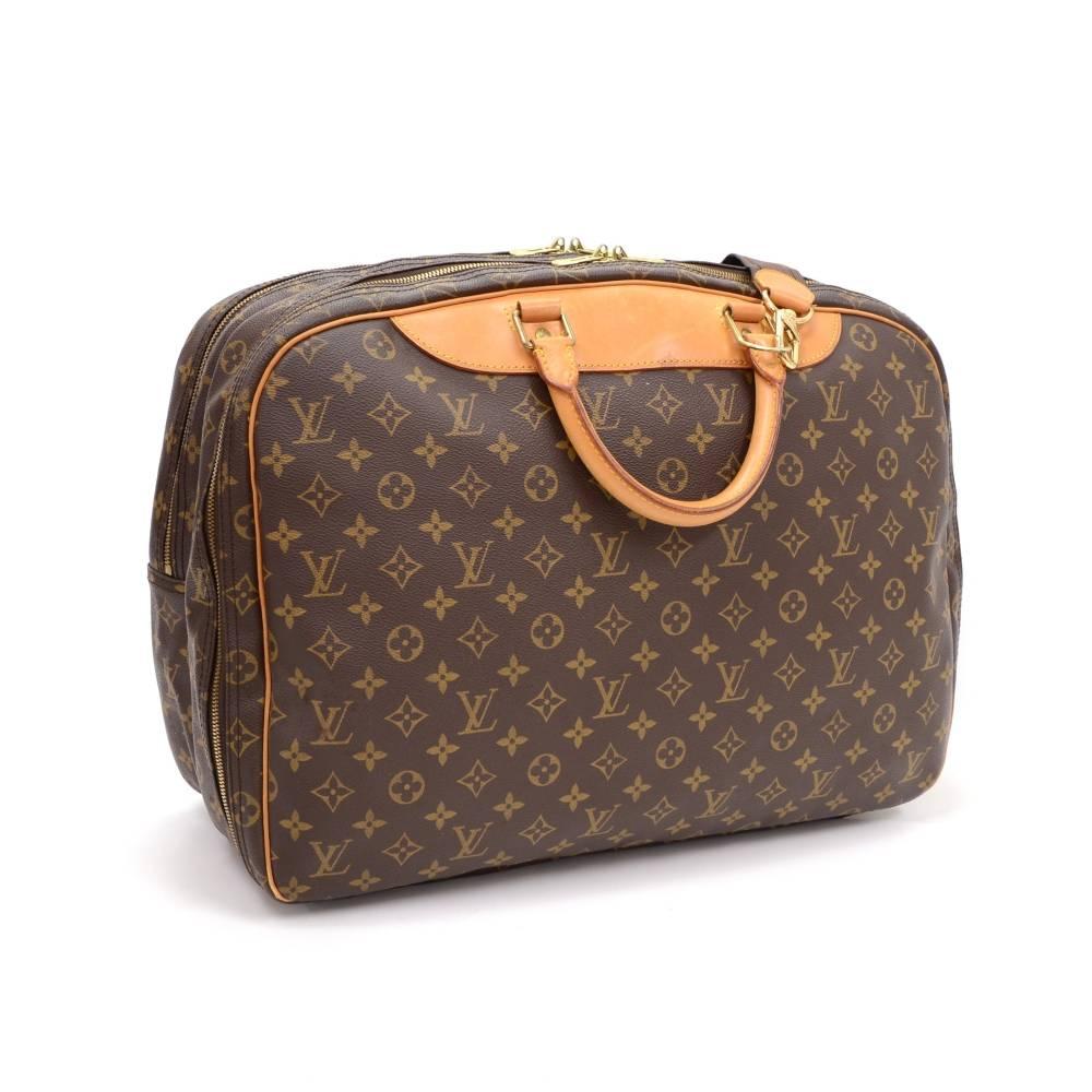 Louis Vuitton Alize 24 Heures travel bag. It has 2 separated compartments both secured with double zippers. Inside has open side pocket and washable lining. Perfect size for short trips combines the flexibility of a light bag with suitcase. Item
