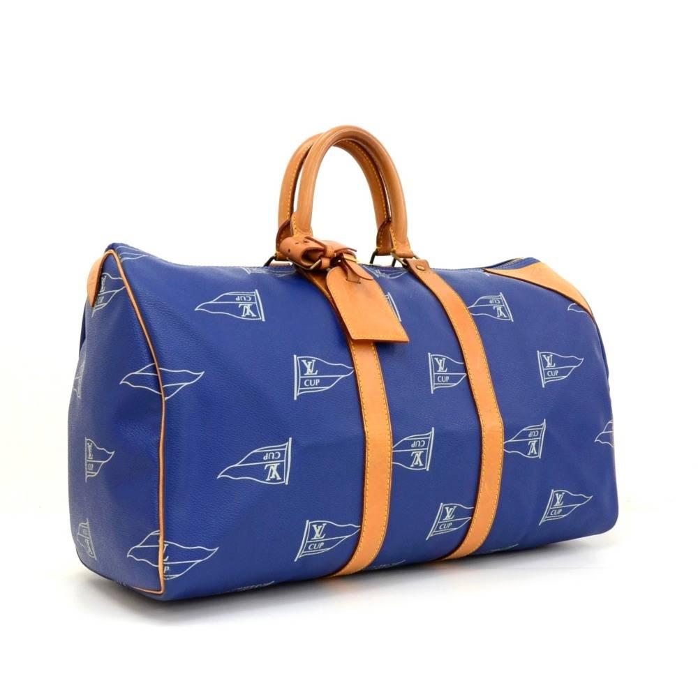 Louis Vuitton Limited edition blue canvas Keepall 45 from the 1995 LV Cup. Inside has gray canvas lining. A very rare limited bag! Limited No. 0 5 7 0. 

Made in: France
Serial Number: S P 0 0 1 2
Size: 17.7 x 9.8 x 7.5 inches or 45 x 25 x 19