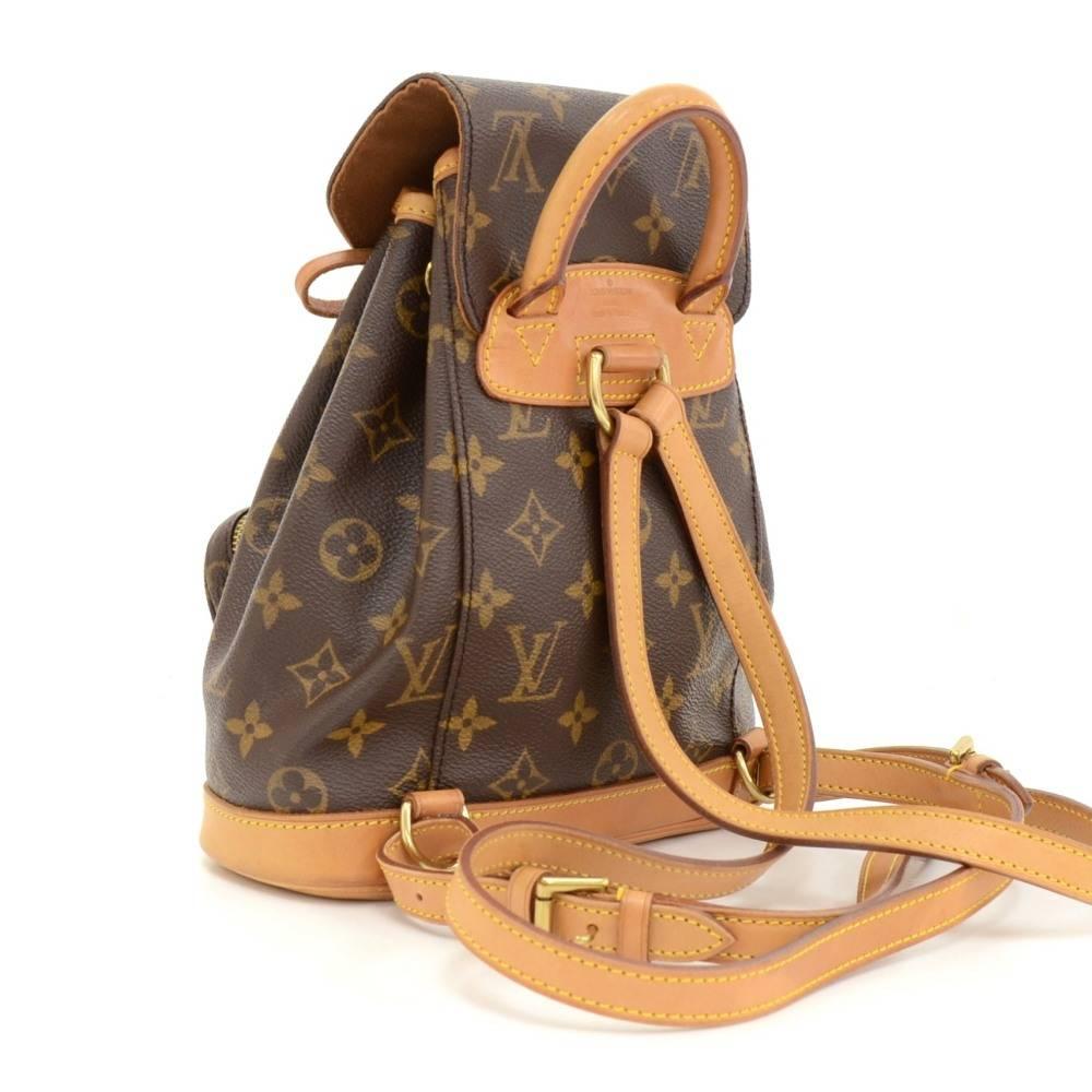 Louis Vuitton Mini Montsouris backpack in monogram canvas. It has 1 zipper pocket on the front. It has leather string closure with flap top for security. Spacious and classy, it would make a great companion wherever you go!

Made in: France
Serial