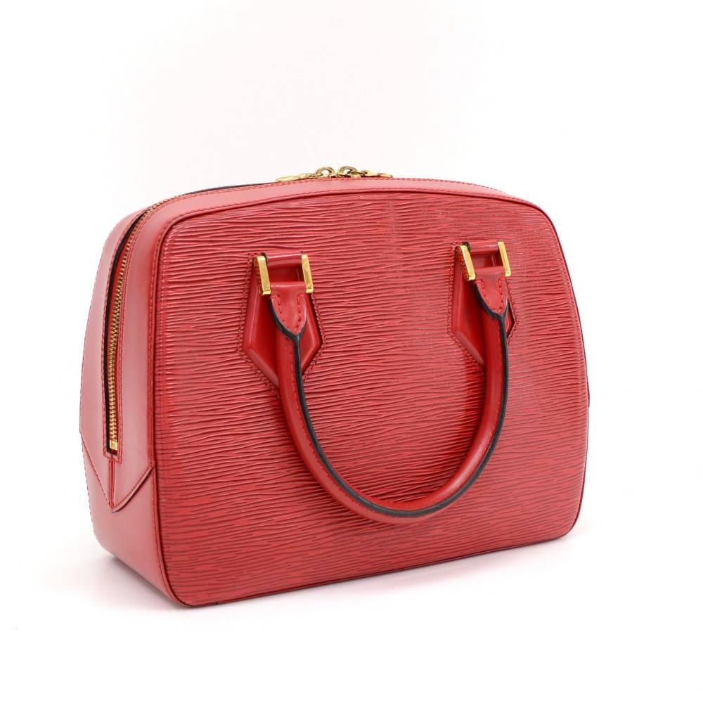 Louis Vuitton Red Sablon bag in Epi leather. Very stylish hand-held bag closed with a double zipper, it features an inside open pocket and nice alkantra lining. Gold hardware. It is discontinued item and hard to find.   

Made in: France
Serial