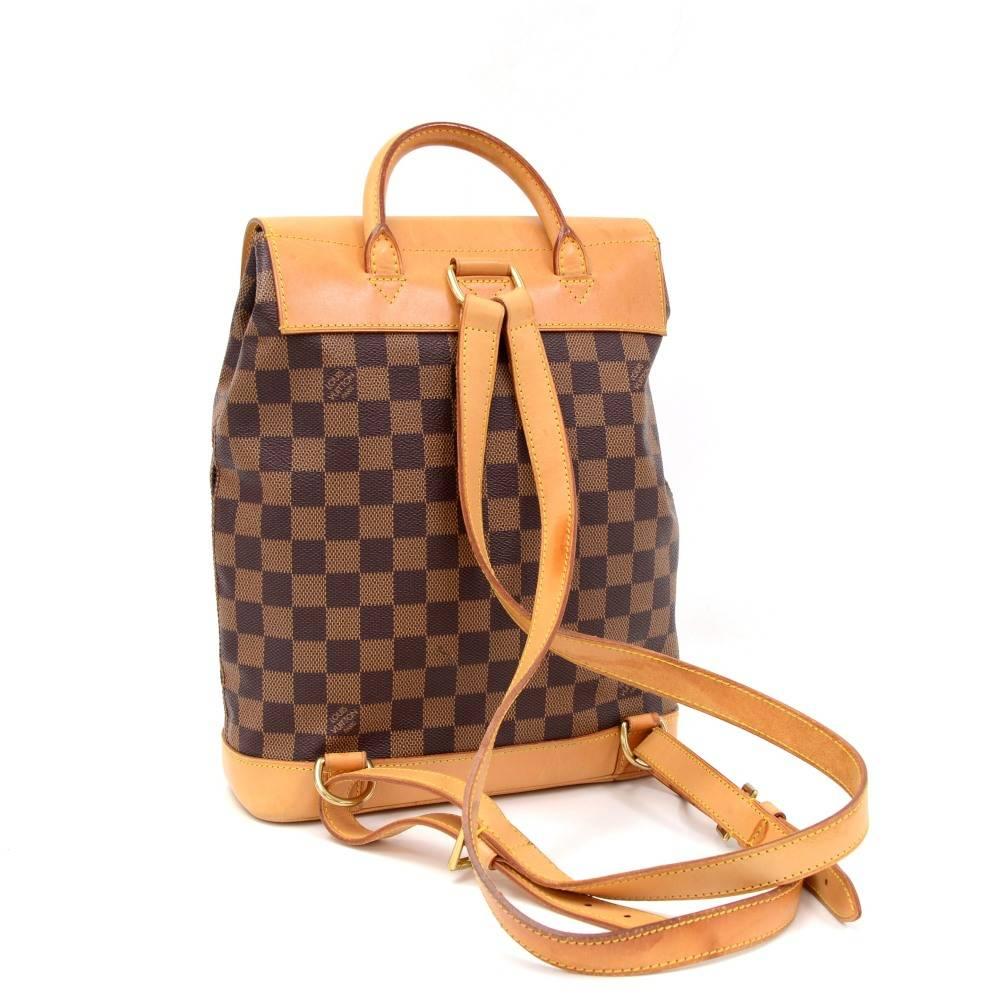 Louis Vuitton Soho Damier with cowhide leather backpack. Its 100 year LV anniversary special limited edition. Flap top secured with belt closure. Inside has 1 open pocket. Very rare limited edition and would make a great companion. Limited No. 2 4 4