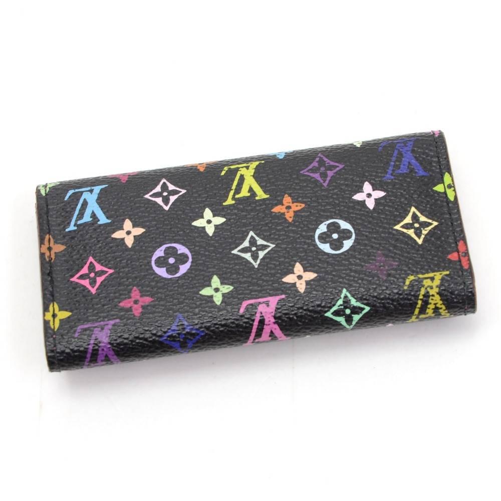 Louis Vuitton Multicles 4 key case in black multicolor monogram canvas. It has stud closure for main compartment and 4 x brass hooks for your keys.

Made in: France
Serial Number: C T 2 1 4 2
Size: 4.1 x 2.8 x 0.4 inches or 10.5 x 7 x 1 cm
Color: