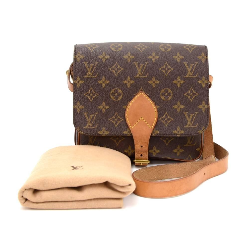 Louis Vuitton Cartouchiere PM in monogram canvas. Flap top secured with belt closure. Inside is brown washable lining. Comfortably carry on shoulder or across body with cowhide leather strap. 

Made in: France
Serial Number: SL 0990
Size: 6.7 x 6.3