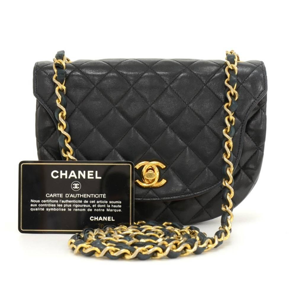Chanel shoulder pochette/bag in black quilted leather. It has flap with CC twist closure on front. Inside has famous Chanel red leather lining with 2 pockets: 1 open and 1 with zipper. Comfortably carried on shoulder or across body.

Made in: