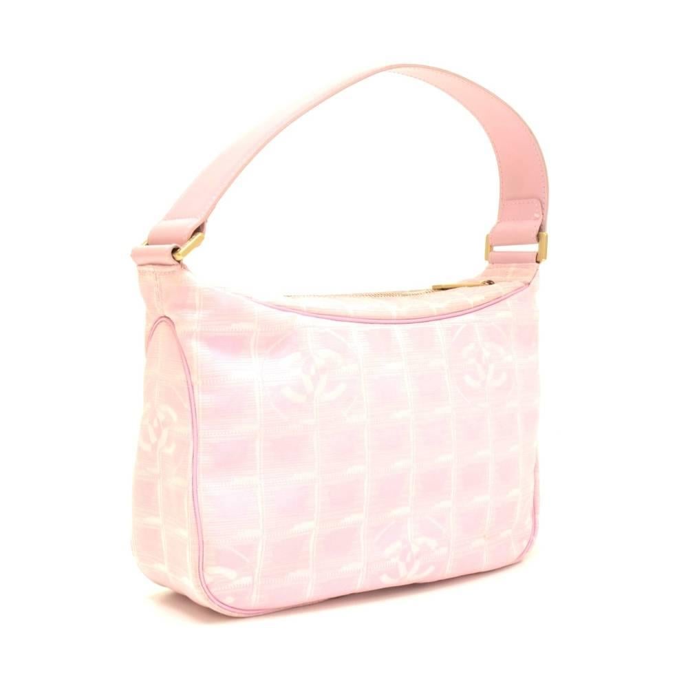 Chanel Travel Line small bag in pink Jacquard nylon. Top has zipper closure. Inside has washable lining. This stunning bag lightweight and easy access. 

Made in: Spain
Serial Number: 8046269
Size: 9.4 x 6.3 x 3.1 inches or 24 x 16 x 8 cm
Color: