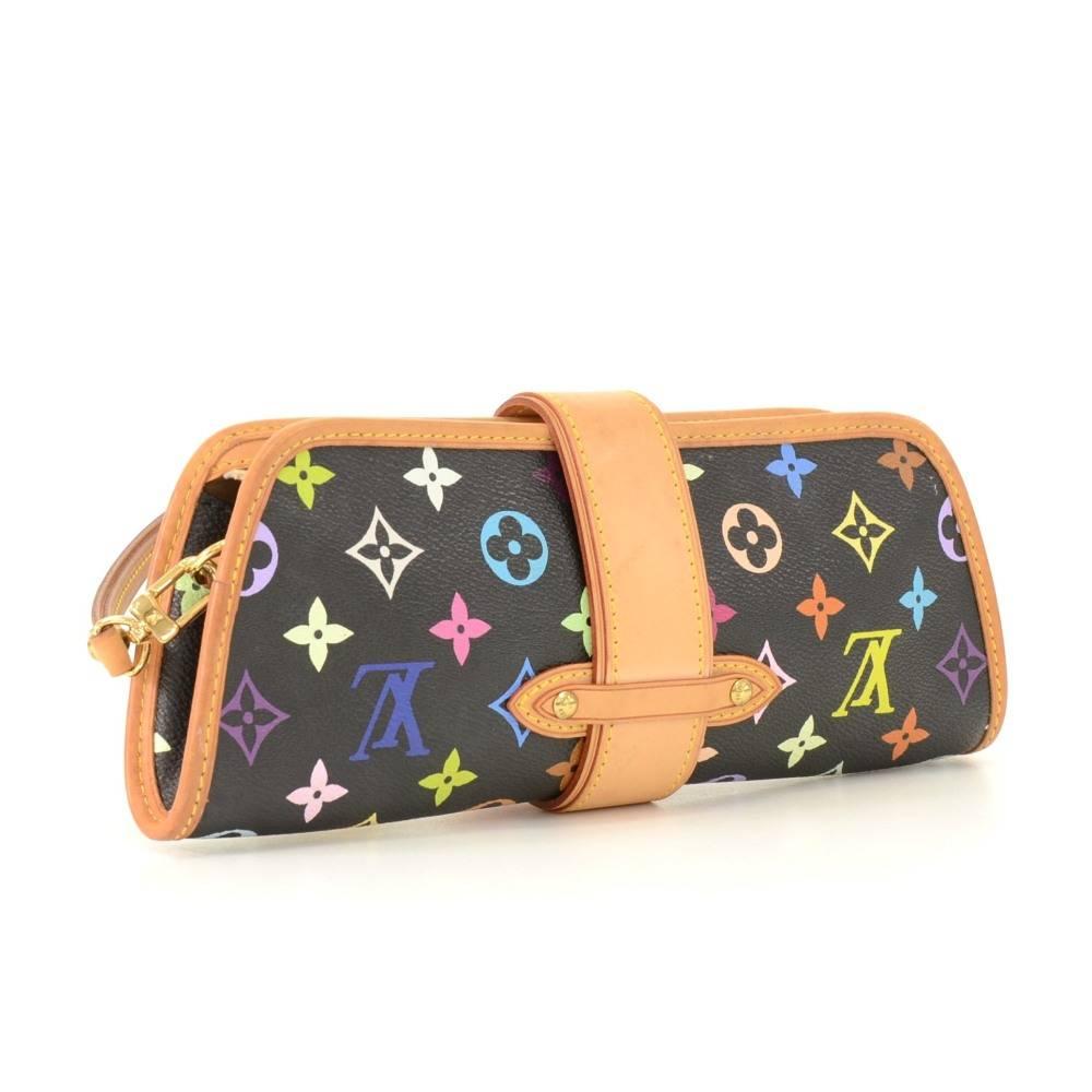 Louis Vuitton Shirley shoulder bag in black multicolor monogram canvas. Top is secured with zipper, cowhide leather belt around and gold tone lock on front. Inside has red leather lining with open space. Comfortably carry on shoulder or in hand or