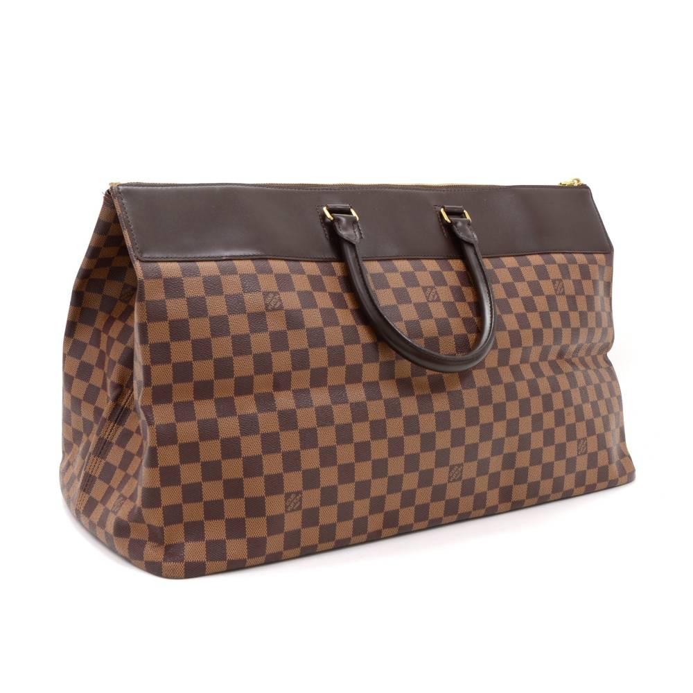 Louis Vuitton Greenwich GM hand bag in damier canvas. Top access is open with large zipper. Inside is in red fabric lining with 1 large zipper pocket. Perfect to carry all necessities for short trip. 

Made in: France
Serial Number: A R 1 9 2