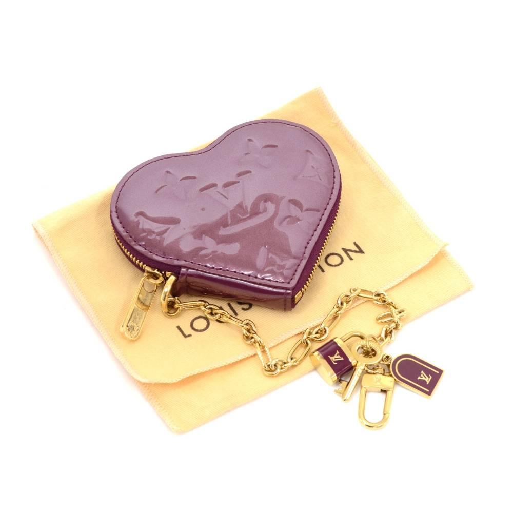 Louis Vuitton coin case in vernis leather. Heart shape coin case secured with zipper and chain.

Made in: France
Serial Number: T H 4 0 3 7
Size: 4.1 x 3.3 x 0 inches or 10.5 x 8.5 x 0 cm
Color: Purple
Dust bag:   Yes included  
Box:   Not included 