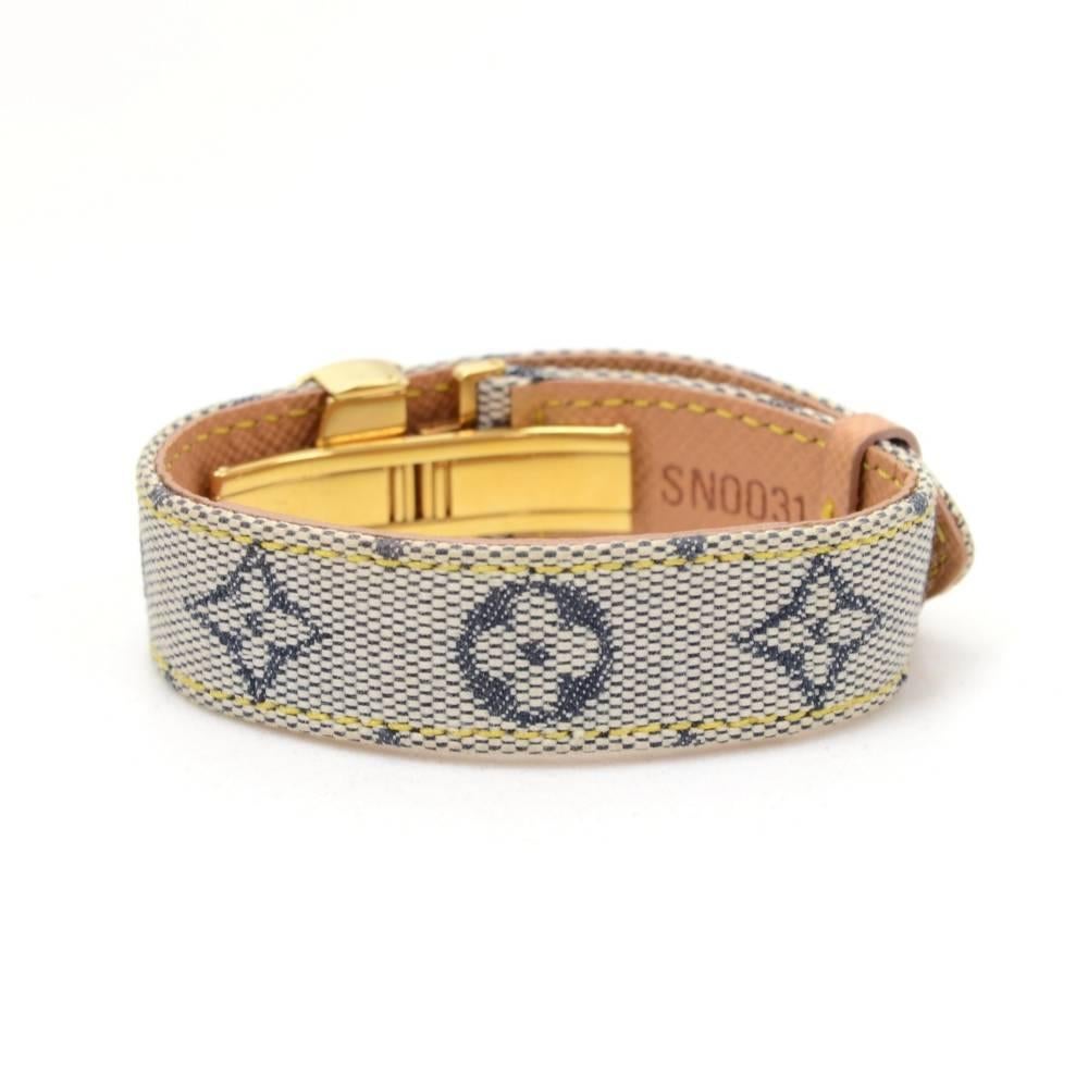 Louis Vuitton bracelet in mini monogram canvas x leather. It is from discontinued collection and it is  very rare to find! Adjustable hardware which can be opened when placed on arm easy and secure. Size: Adjustable between app 6.7 - 7.5 inches or
