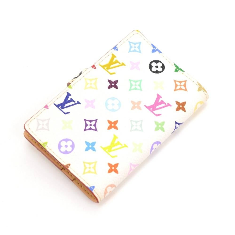 Louis Vuitton white Multicolor agenda cover with 1 slip in pocket. It comes with address book which shows some use.

Made in: France
Serial Number: S R 0 0 9 3
Size: 2.8 x 3.9 x 0.4 inches or 7 x 10 x 1 cm
Color: White
Dust bag:   Not included 