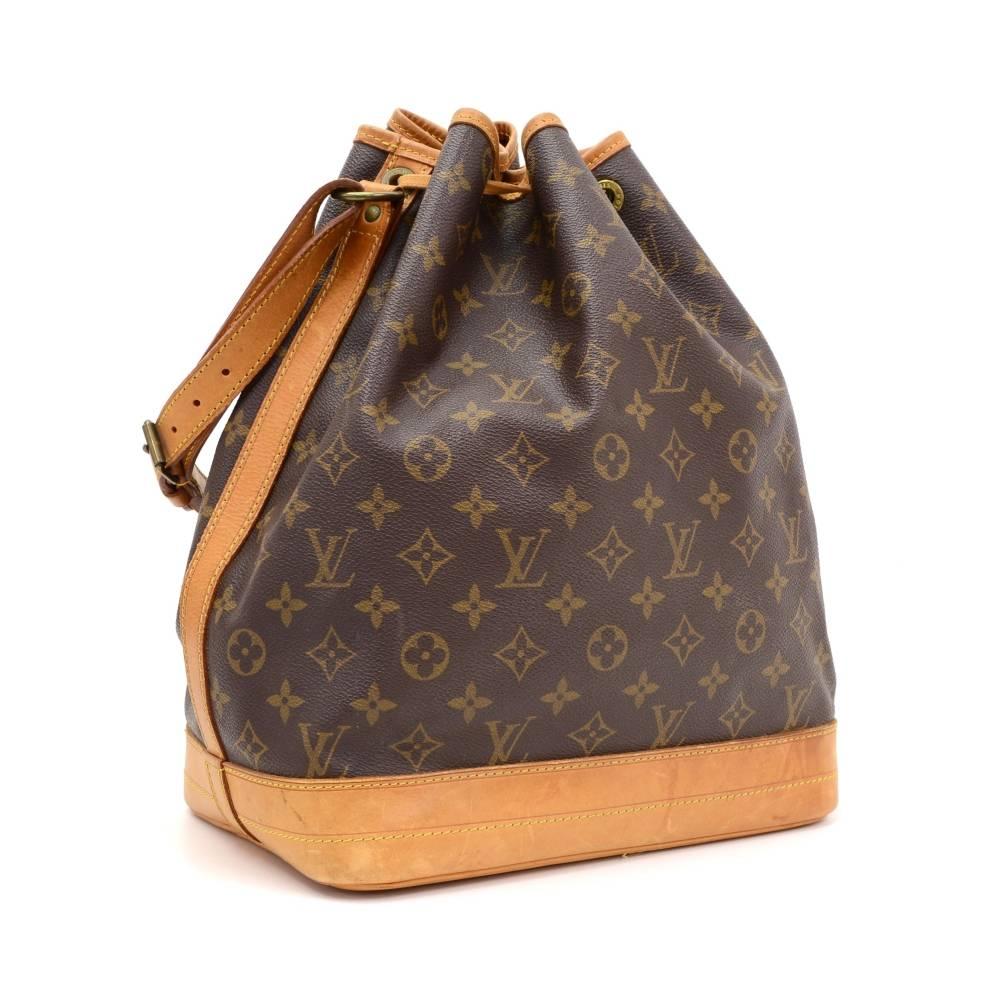 Louis Vuitton Noe shoulder bag. It has adjustable shoulder strap and tie up string closure. Inside is brown lining. The famous champagne bag created in 1932 which makes it a true classic.

Made in: France
Serial Number: AR8907
Size: 10.2 x 13.4 x