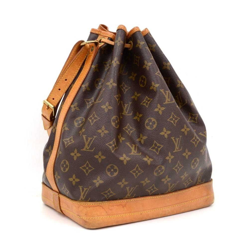 Louis Vuitton Noe shoulder bag. It has adjustable shoulder strap and tie up string closure. Inside is brown lining. The famous champagne bag created in 1932 which makes it a true classic.

Made in: France
Serial Number: AR0963
Size: 10.2 x 13.4 x