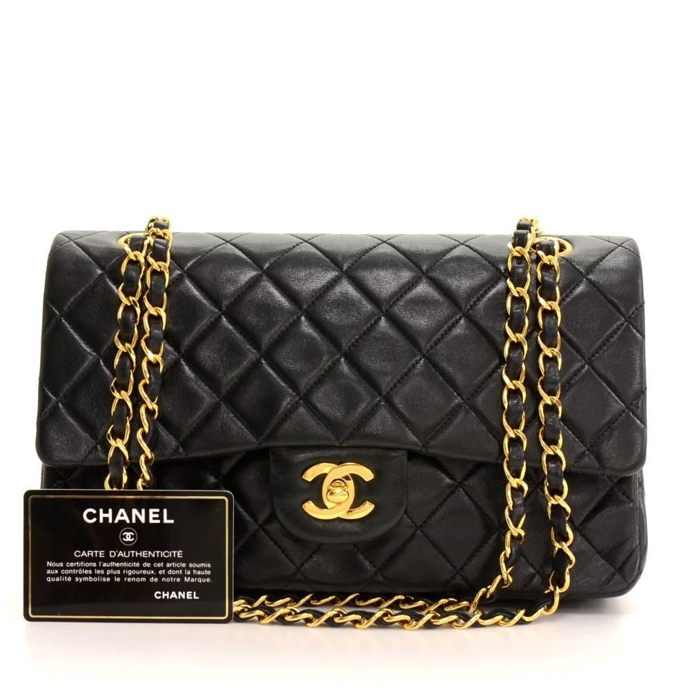 Chanel black quilted leather bag with double flap. It has CC twist lock on the front flap. Second flap has stud closure. Underneath it, there is one slip in pocket and inside lining is in famous Chanel red leather. One interior open pocket is split