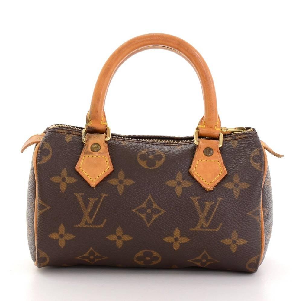 Louis Vuitton handbag Mini Speedy Sac HL, one of the most popular line in LV monogram canvas. Brass zipper securing access. Inside is brown lining. Very cute item to have. 

Made in: France
Serial Number: TH0918
Size: 5.9 x 3.9 x 2.8 inches or 15 x