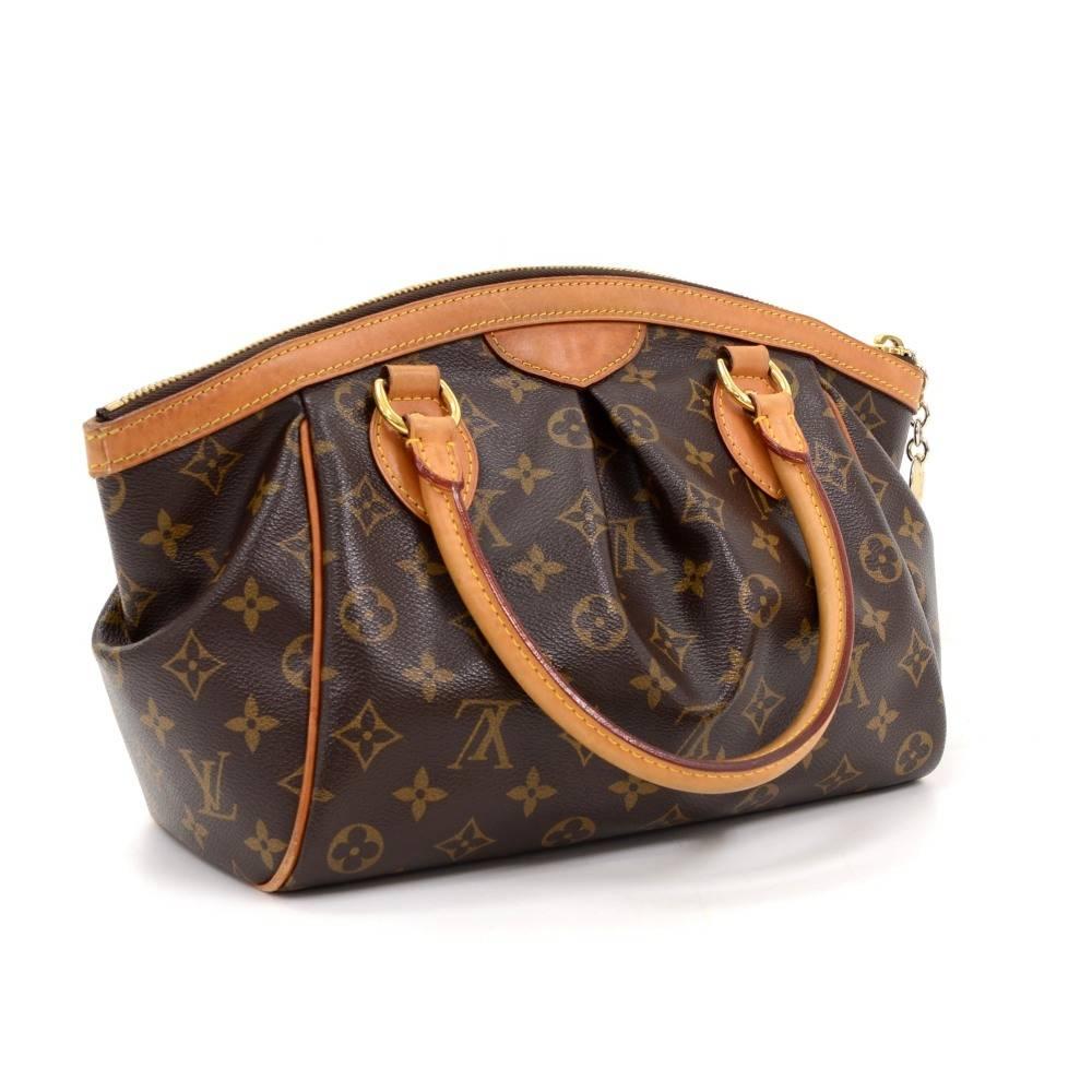 Louis Vuitton Tivoli PM handbag in Monogram canvas. Top is closed with zipper. Inside has brown fabric lining and 1 open pocket and 1 for mobile or glasses. It is specially designed to keep all your items perfectly organized!

Made in: France
Serial