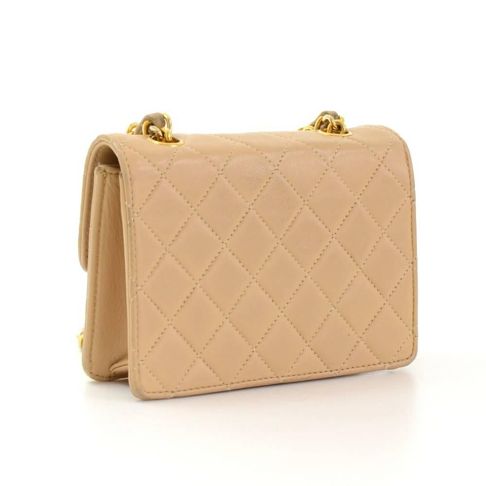 Chanel beige quilted leather mini bag. It has flap and CC twist lock on the front. Inside has Chanel beige leather lining. It can be used as shoulder bag or across the body.

Made in: France
Serial Number: 1880606
Size: 5.5 x 3.9 x 1.6 inches or 14