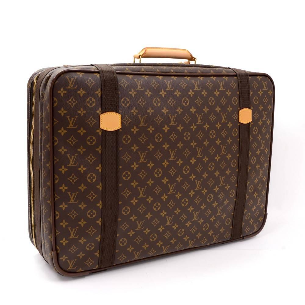 Louis Vuitton monogram Satellite 65 travel bag. Main access is double zipper and 2 belt closures. Inside has washable lining with large open pocket and rubber band keep your things organize. Perfect size for your trips, combines the flexibility of a