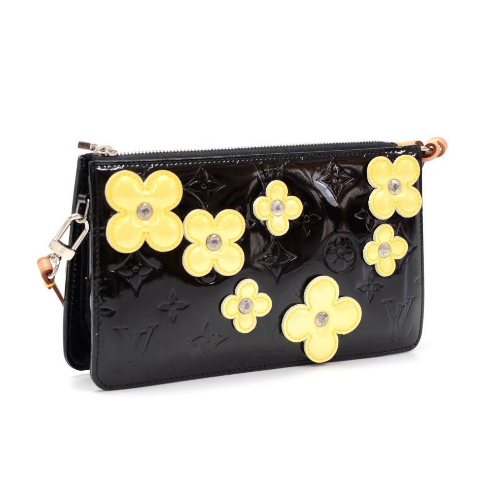 Louis Vuitton Lexington Pochette in vernis leather with flowers. This is a limited edition which was introduced in the year 2001 and it is hard to get.

Made in: Spain
Serial Number: CA0022
Size: 7.9 x 4.5 x 1.6 inches or 20 x 11.5 x 4 cm
Shoulder