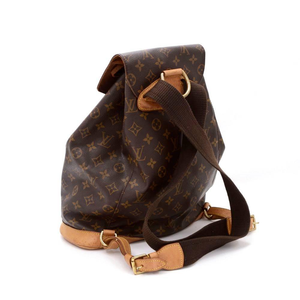 Louis Vuitton backpack Montsouris GM in Monogram canvas. It features one external pocket with a zipper on the front and one internal open pocket. It has leather pull string closure with flap top for security.

Made in: France
Serial Number: