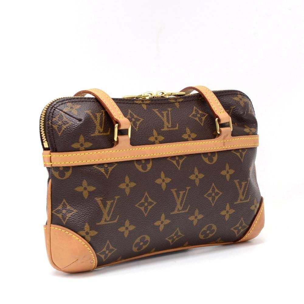 This is Louis Vuitton Mini Coussin Hand Bag in monogram canvas. It has double zipper closure. On the inside has red alkantra lining with 1 open pocket. Great size to keep you organized. 

Made in: France
Serial Number: VI 0024
Size: 9.4 x 5.5 x 2