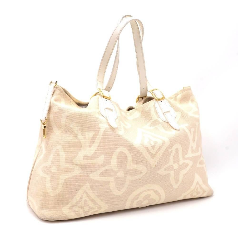 Louis Vuitton Tahitienne Cabas GM tote bag in white x beige monogram cotton. Inside is in lovely lining with 1 zipper pocket and 1 for mobile. Extremely rare bag to find.

Made in: France
Serial Number: T H 1 0 7 6
Size: 19.7 x 13 x 7.5 inches or 50