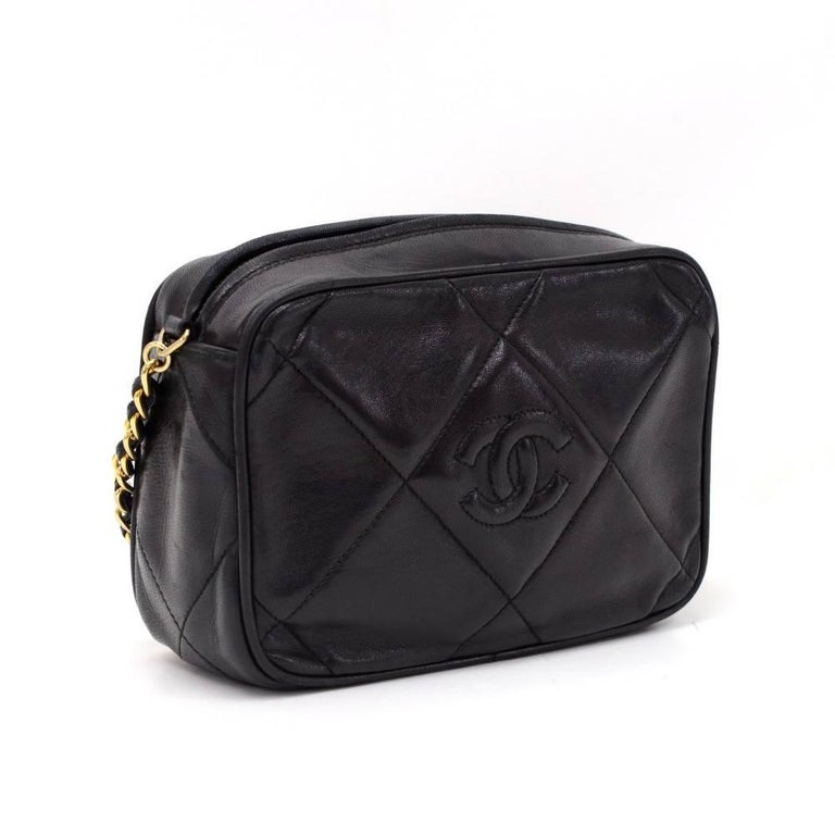 Chanel shoulder pochette/bag in black quilted leather. Top access with zipper and fringe is attached on zipper pull. Inside has black leather lining with 1 zipper pocket. Comfortably carried on shoulder.

Made in: Italy
Serial Number: 0874823
Size: