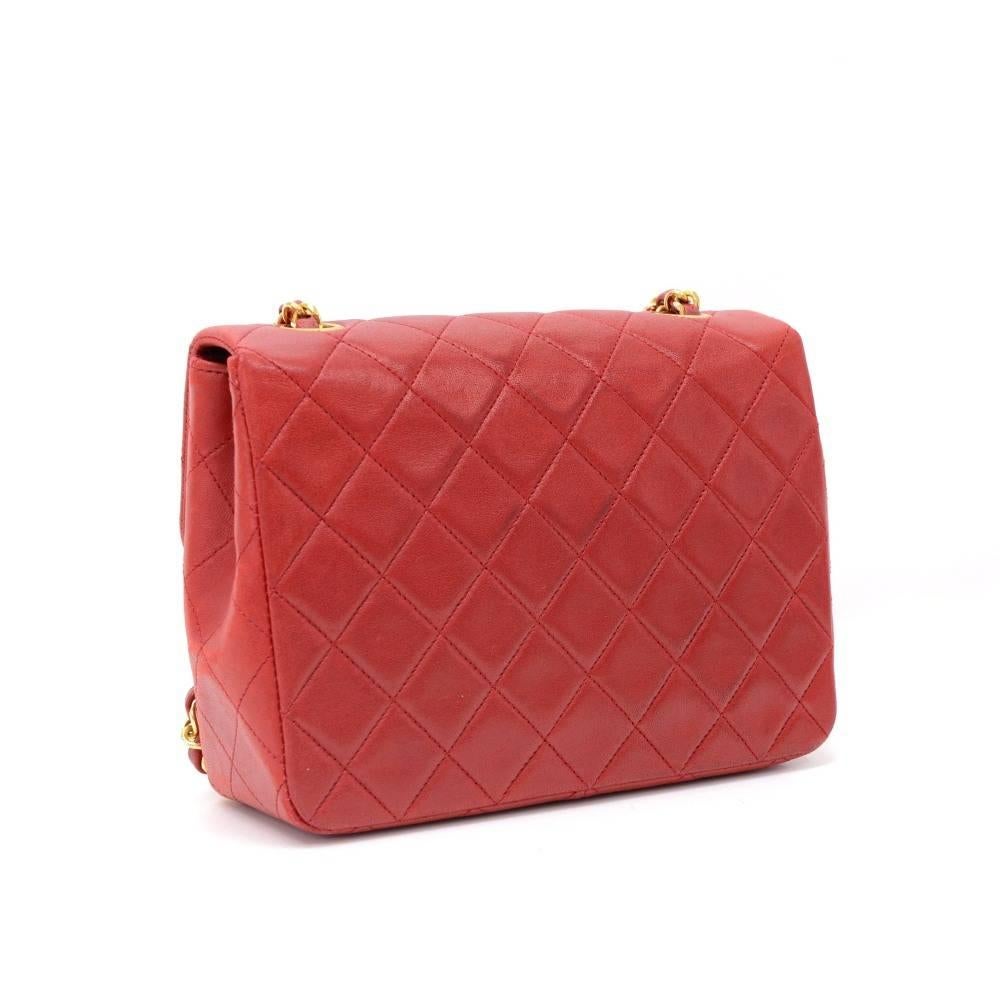 Chanel red quilted leather mini bag. It has flap and CC twist lock on the front. Inside has red leather lining and 2 pockets; 1 zipper and 1 open slit into 3 compartment. It can be used as shoulder bag or across the body.

Made in: France
Serial