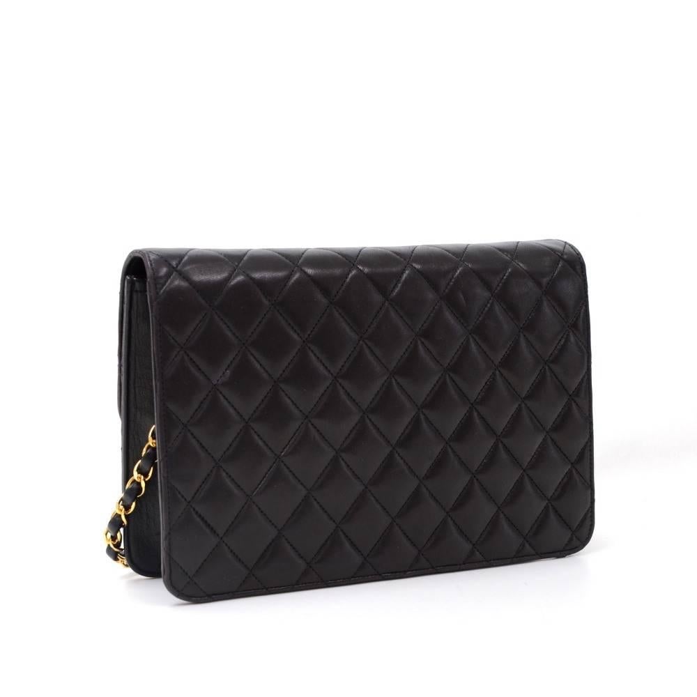Chanel black quilted leather bag. It has flap with CC logo stud lock on the front. On the inside, it has Chanel red leather lining with one zipper pocket. It can be used as shoulder bag or clutch. 

Made in: France
Serial Number: 3596432
Size: 9.8 x
