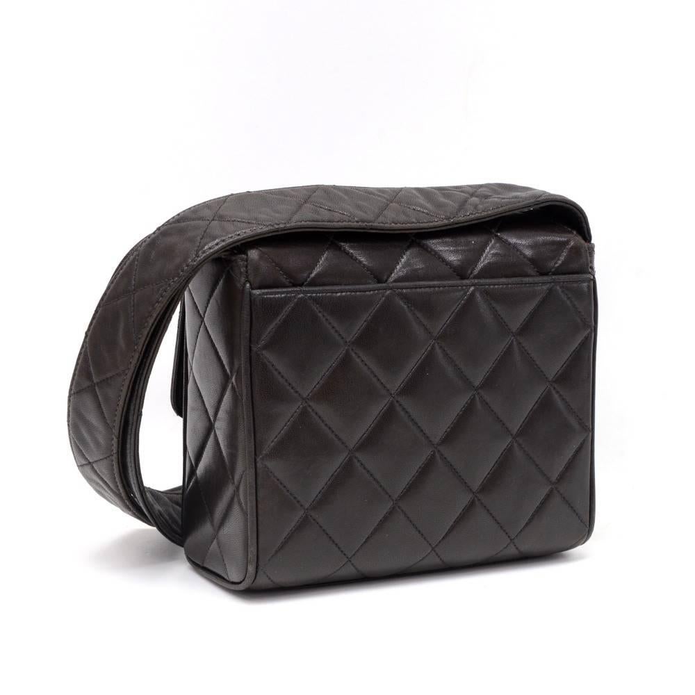 Chanel black quilted leather shoulder bag. It is secured with flap and magnetic lock. On the back has one open pocket. Inside has Chanel red leather with 2 pockets; one with a zipper and one opened. Carried on shoulder with leather strap

Made in: