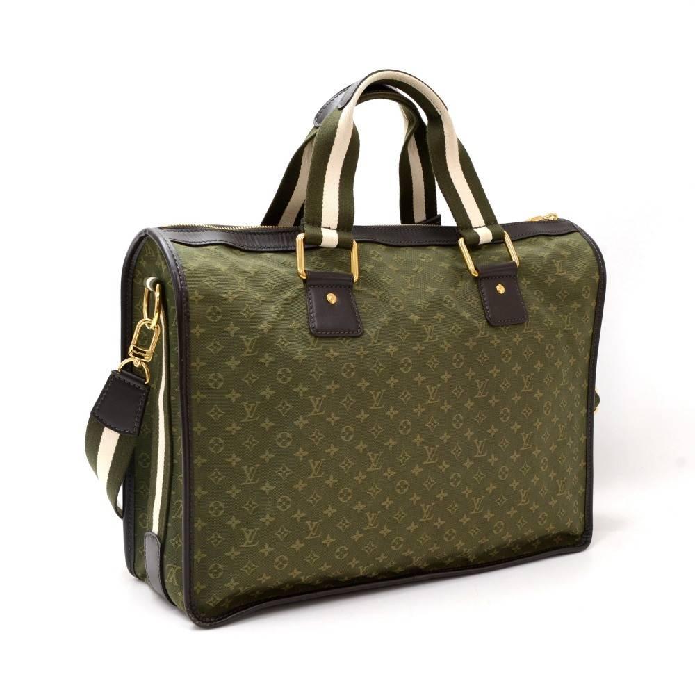 Louis Vuitton Sac Mary Kate 48H tote in khaki Monogram Mini Line. Outside has 2 small pockets with flap and stud lock in front. Top is secured with zipper. Inside is in lime green fabric lining with 1 open pocket and 1 for mobile or glasses.